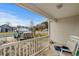 View from the front porch showcasing a white railing and a cozy seating area at 1236 Pollen Loop, Murrells Inlet, SC 29576