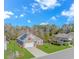 Charming single-Gathering house with a well-manicured lawn, colorful plants, and solar panels at 124 Castaway Key Dr., Pawleys Island, SC 29585