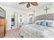 Charming bedroom features an open ensuite bathroom, soft tones, and ample natural light at 1335 Wading Bird Ln., Myrtle Beach, SC 29577