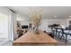 A dining room boasting a large wooden table with seating for six and an open view into the living room at 148 Leyland Cypress Dr, Conway, SC 29527