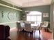 Formal dining room with hardwood floors, elegant decor, and a large window at 153 Highmeadow Ln., Aynor, SC 29511