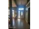 Bright entryway with tile flooring and natural light from a decorative front door at 153 Highmeadow Ln., Aynor, SC 29511