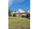 Charming brick home featuring a well-manicured lawn, mature landscaping, and traditional architecture at 153 Highmeadow Ln., Aynor, SC 29511