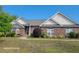 Charming brick home with lush landscaping and a well-manicured lawn at 153 Highmeadow Ln., Aynor, SC 29511