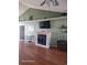Cozy living room with a fireplace, hardwood floors, and stylish decor at 153 Highmeadow Ln., Aynor, SC 29511