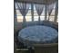 Sunroom with a table and seating, surrounded by windows offering views of the pool at 153 Highmeadow Ln., Aynor, SC 29511