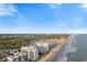 Beautiful aerial view showcases the coastline, beach, and surrounding landscape at 161 Seawatch Dr. # 1101, Myrtle Beach, SC 29572