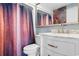 Well-maintained bathroom featuring a shower with a patterned curtain, a vanity with a sink, and a mirror at 161 Seawatch Dr. # 1101, Myrtle Beach, SC 29572