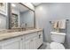 Updated bathroom with granite countertop, white cabinets, and decorative mirror at 161 Seawatch Dr. # 1101, Myrtle Beach, SC 29572