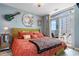 Comfortable bedroom with exterior balcony access, stylish decor, and natural light at 161 Seawatch Dr. # 1101, Myrtle Beach, SC 29572