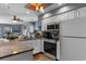 Modern kitchen with granite countertops, stainless steel appliances, white cabinets, and pendant lighting at 161 Seawatch Dr. # 1101, Myrtle Beach, SC 29572