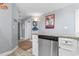 Kitchen space with gray accents featuring a stainless steel dishwasher and granite counter tops at 161 Seawatch Dr. # 1101, Myrtle Beach, SC 29572