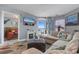 Inviting living room with a plush sectional, fireplace, TV, and access to a private balcony at 161 Seawatch Dr. # 1101, Myrtle Beach, SC 29572