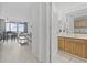 A bathroom leads to a bright living area with balcony access and comfortable seating for relaxation at 200 76Th Ave. N # 510, Myrtle Beach, SC 29572