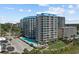 Aerial view of a beachfront complex, showcasing multiple pools, greenery, and balcony-rich units at 200 76Th Ave. N # 510, Myrtle Beach, SC 29572