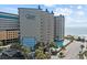 Oceanfront condo building with pool, balconies, and beach access at 200 76Th Ave. N # 510, Myrtle Beach, SC 29572