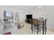 Bright living room with modern furniture, wood-look floors, and a large TV at 200 76Th Ave. N # 510, Myrtle Beach, SC 29572