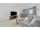 Cozy living room with modern furniture, a TV, and balcony access for enjoying outdoor views at 200 76Th Ave. N # 510, Myrtle Beach, SC 29572