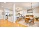 Kitchen and dining area featuring stainless appliances, granite counters and a dining table at 203 Da Gullah Way # C, Pawleys Island, SC 29585