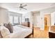 Light-filled main bedroom boasting a seating area, dresser, and hardwood flooring at 203 Da Gullah Way # C, Pawleys Island, SC 29585