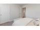 Bright bedroom featuring neutral walls, carpet, and a doorway to another room at 210 Bald Cypress Way, Conway, SC 29527