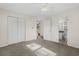 Bright bedroom featuring neutral walls, carpet, and large closet with access to bathroom and other rooms at 2148 Brunswick Circle, Little River, SC 29566