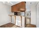 Open kitchen area featuring wood cabinets and a breakfast bar, great for casual dining at 2148 Brunswick Circle, Little River, SC 29566