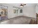 Inviting living room with tile floors, a cozy brick fireplace, and a classic corner cabinet at 2148 Brunswick Circle, Little River, SC 29566