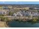 Aerial view of a condo community, showcasing golf courses, lakes, and lush greenery at 2557 Pete Dye Dr. # 403, North Myrtle Beach, SC 29582
