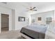 Bright main bedroom features a ceiling fan and two windows at 2557 Pete Dye Dr. # 403, North Myrtle Beach, SC 29582