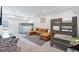 Spacious recreation room with brown sectional and bunk beds, great for entertaining guests at 2557 Pete Dye Dr. # 403, North Myrtle Beach, SC 29582