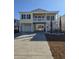 Charming elevated beach house with a spacious driveway, lush landscaping, and a two-story porch at 328 46Th Ave. N, North Myrtle Beach, SC 29582