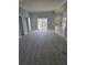 Spacious living room with sliding glass doors to the outdoor deck with views of the neighborhood at 328 46Th Ave. N, North Myrtle Beach, SC 29582