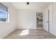 A simple room with gray wood laminate flooring and a window to bring in natural light at 3555 Highway 544 # 17F, Conway, SC 29526