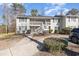 Charming two-story condo building with a white staircase leading to the upper units at 3555 Highway 544 # 17F, Conway, SC 29526