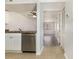 Open kitchen with stainless steel dishwasher and tile flooring adjacent to the living area at 3555 Highway 544 # 17F, Conway, SC 29526