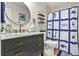 Modern bathroom with marble countertop, vanity and decorative coastal accents at 402 13Th Ave. S, North Myrtle Beach, SC 29582