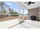 Screened porch with ceiling fan, concrete flooring, and large backyard at 4044 Highway 905, Conway, SC 29526