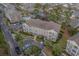 Aerial view of a condo with community pool, landscaping, and parking at 4179 Hibiscus Dr. # 303, Little River, SC 29566