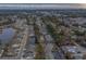 Overhead shot of a community featuring condo buildings, homes, a pond, and scenic coastal views at 4179 Hibiscus Dr. # 303, Little River, SC 29566