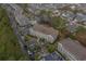 Aerial view showcasing the condo buildings with an outdoor pool, landscaping, and residential neighborhood at 4179 Hibiscus Dr. # 303, Little River, SC 29566