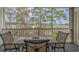 Enjoy outdoor dining on the balcony with views of the surrounding landscape at 4179 Hibiscus Dr. # 303, Little River, SC 29566