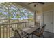 Balcony with table and chairs, overlooking the community, offering great natural light at 4179 Hibiscus Dr. # 303, Little River, SC 29566
