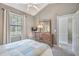 Comfortable bedroom with a dresser, ceiling fan, and window to let light in at 4179 Hibiscus Dr. # 303, Little River, SC 29566