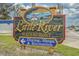 Eye-catching sign for Little River Waterfront, promoting dining, shops, and recreation at 4179 Hibiscus Dr. # 303, Little River, SC 29566