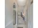 Hallway view into living area with carpet, tile and an arched doorway to kitchen at 4179 Hibiscus Dr. # 303, Little River, SC 29566