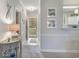 Hallway with decorative accents leading to the front door and providing access to the main living areas at 4179 Hibiscus Dr. # 303, Little River, SC 29566
