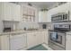 Well-equipped kitchen with stainless steel appliances, white cabinetry, and granite countertops at 4179 Hibiscus Dr. # 303, Little River, SC 29566