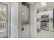 Stackable washer/dryer unit located near the kitchen with stainless steel appliances at 4179 Hibiscus Dr. # 303, Little River, SC 29566