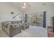 Living room with ceiling fan, nautical decor, and access to a balcony at 4179 Hibiscus Dr. # 303, Little River, SC 29566